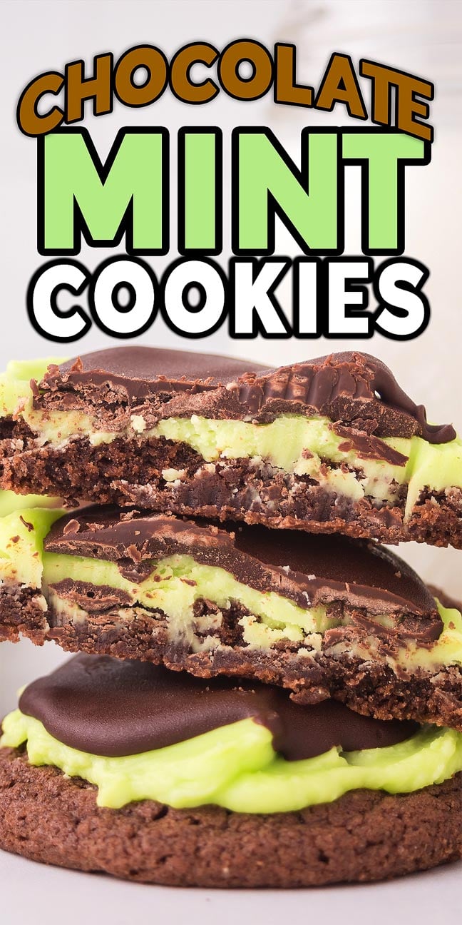 A stack of chocolate mint cookies with green mint filling and a rich chocolate coating on top.