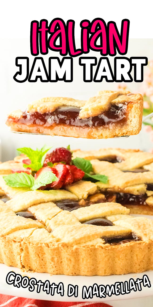 A slice of crostata di marmellata is held above a whole tart, garnished with strawberries and mint.