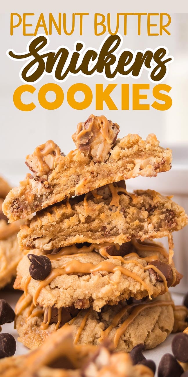 A stack of Peanut Butter Snickers Cookies drizzled with creamy peanut butter and sprinkled with chocolate chips, close up.