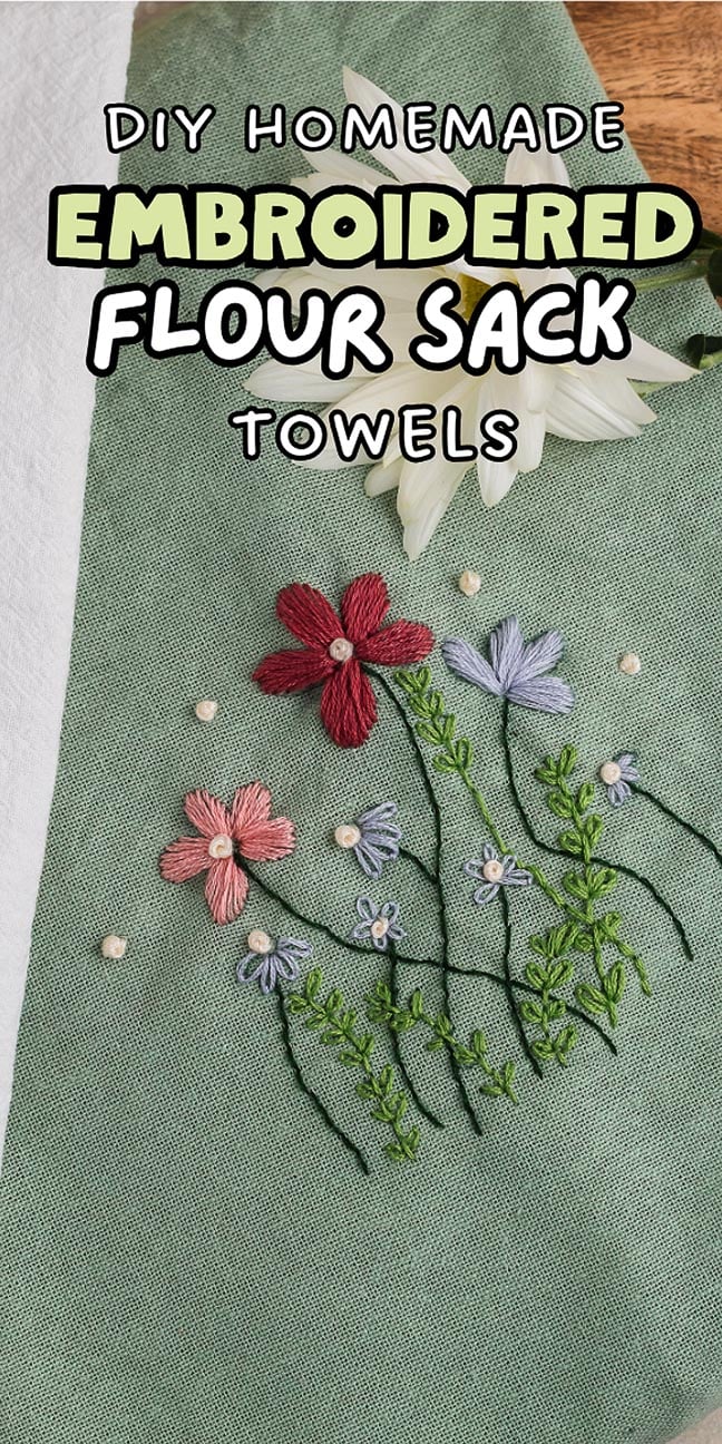 Green towel with embroidered red and purple flowers, text reads "DIY embroidered flour sack towels." Add a personalized touch to your kitchen with these charming homemade creations.