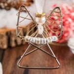 Easy personalized paper clip angel ornament with a pearl head and "Alyssa" spelled on beads, hanging from a white ribbon.