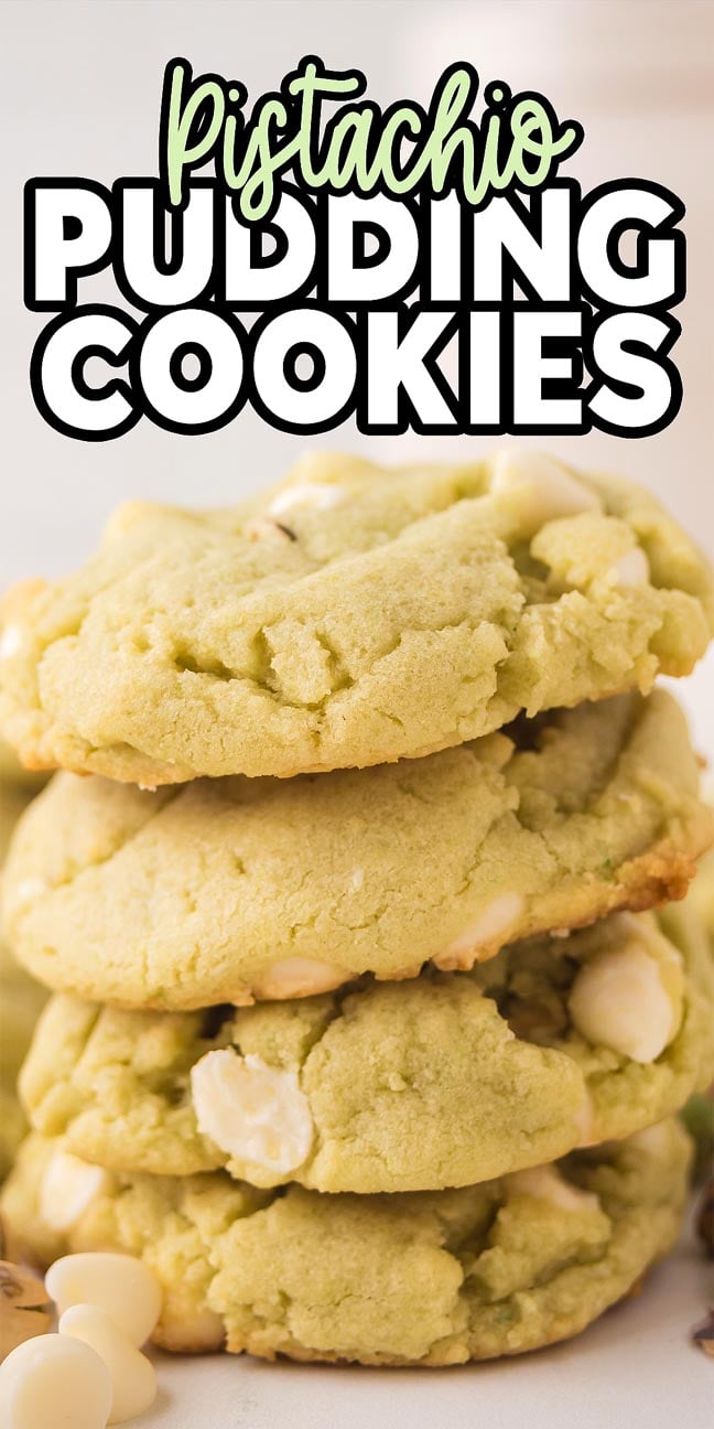 A stack of soft Pistachio Pudding Cookies with white chocolate chips, topped with bold text.