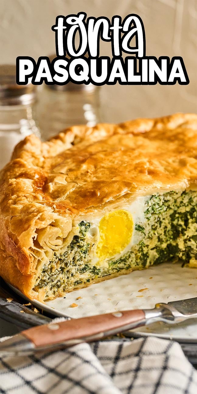 A slice of Torta Pasqualina reveals spinach, creamy ricotta, and a whole egg baked inside golden pastry—an Italian Easter classic.