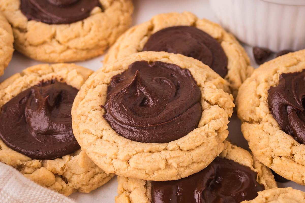 Classic Chocolate Thumbprint Cookies. topped with swirled chocolate frosting.