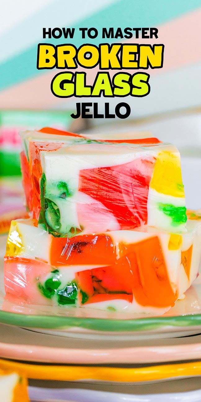 Three colorful cubes of Broken Glass Jello stacked on a plate with text "How to Master Broken Glass Jello.
