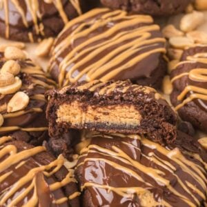 Buckeye Cookies: Chocolate cookies with peanut butter filling, topped with chocolate, peanut butter drizzle, and crunchy peanuts.