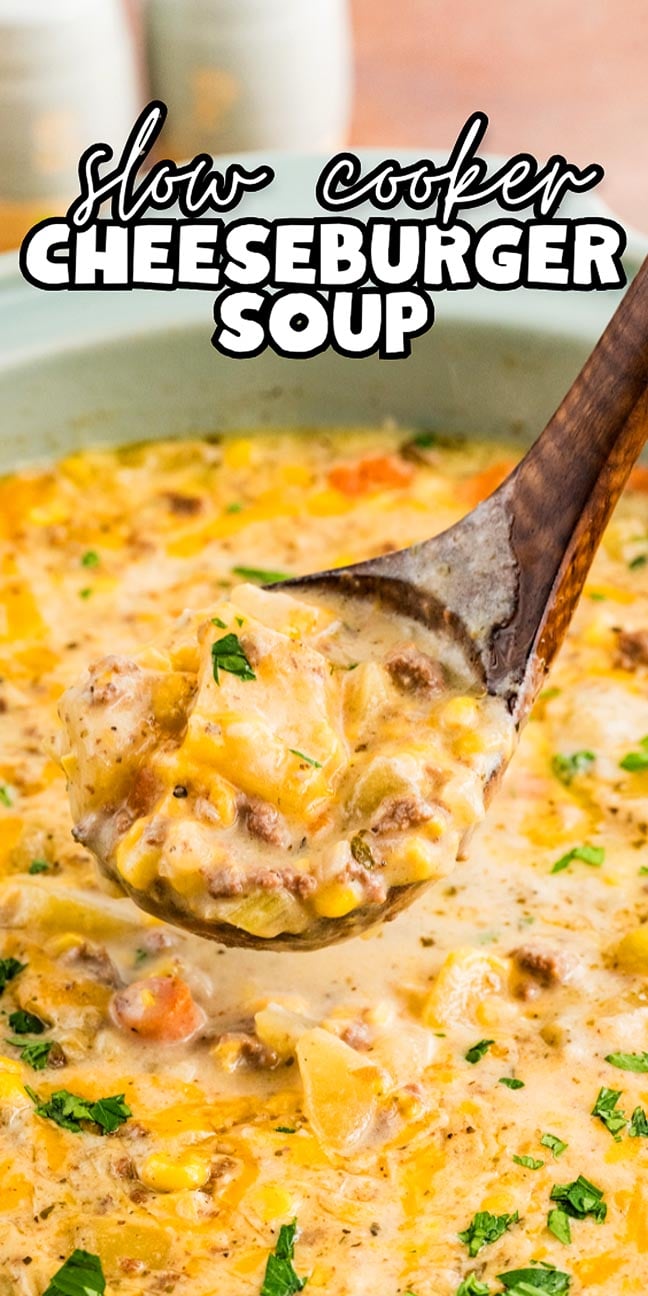 A wooden ladle scoops creamy Slow Cooker Cheeseburger Soup filled with ground beef, potatoes, and vegetables.