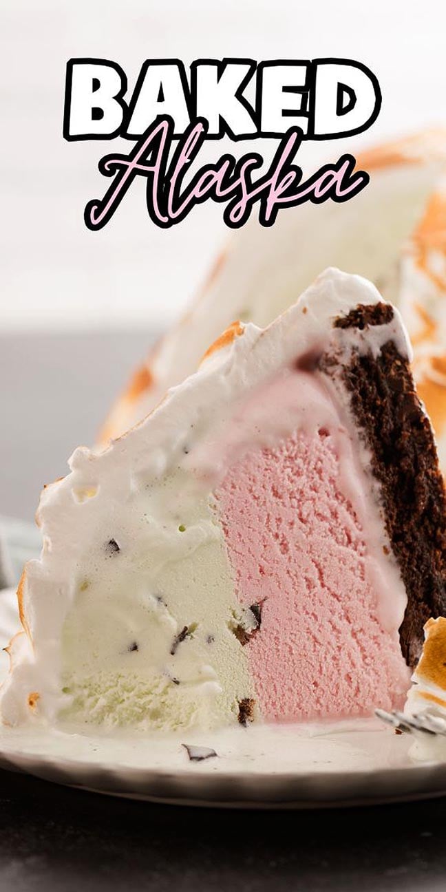 Slice of Baked Alaska cake showcasing layers of chocolate, strawberry, and mint ice cream, perfectly topped with golden meringue.