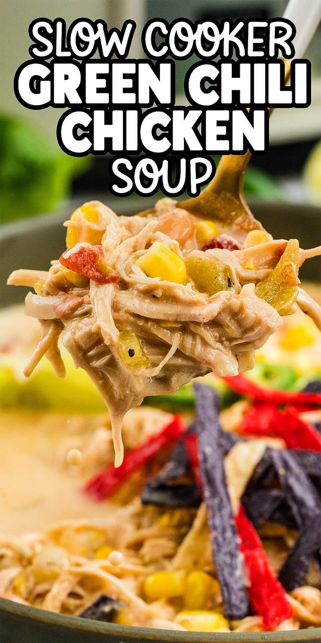 A ladle of creamy Slow Cooker Green Chile Chicken Soup with corn, tomatoes, and tortilla strips hovers over a pot.