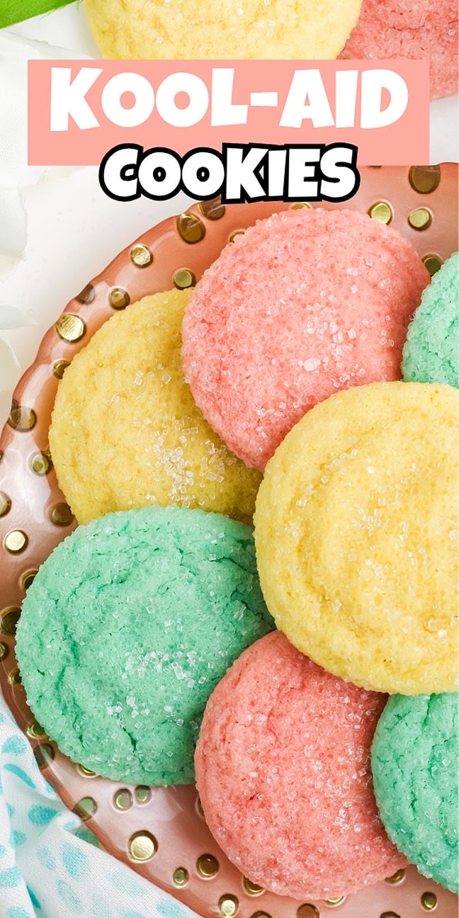Plate of colorful pink, yellow, and green Kool-Aid Cookies topped with sugar; text reads "Kool-Aid Cookies.
