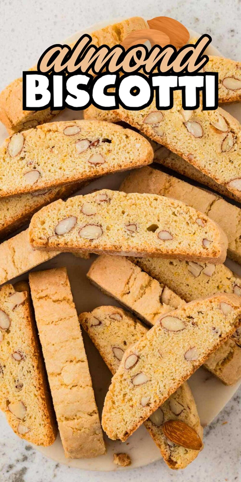 A plate of Almond Biscotti slices, with visible almond pieces, arranged on a light surface for a delightful treat.