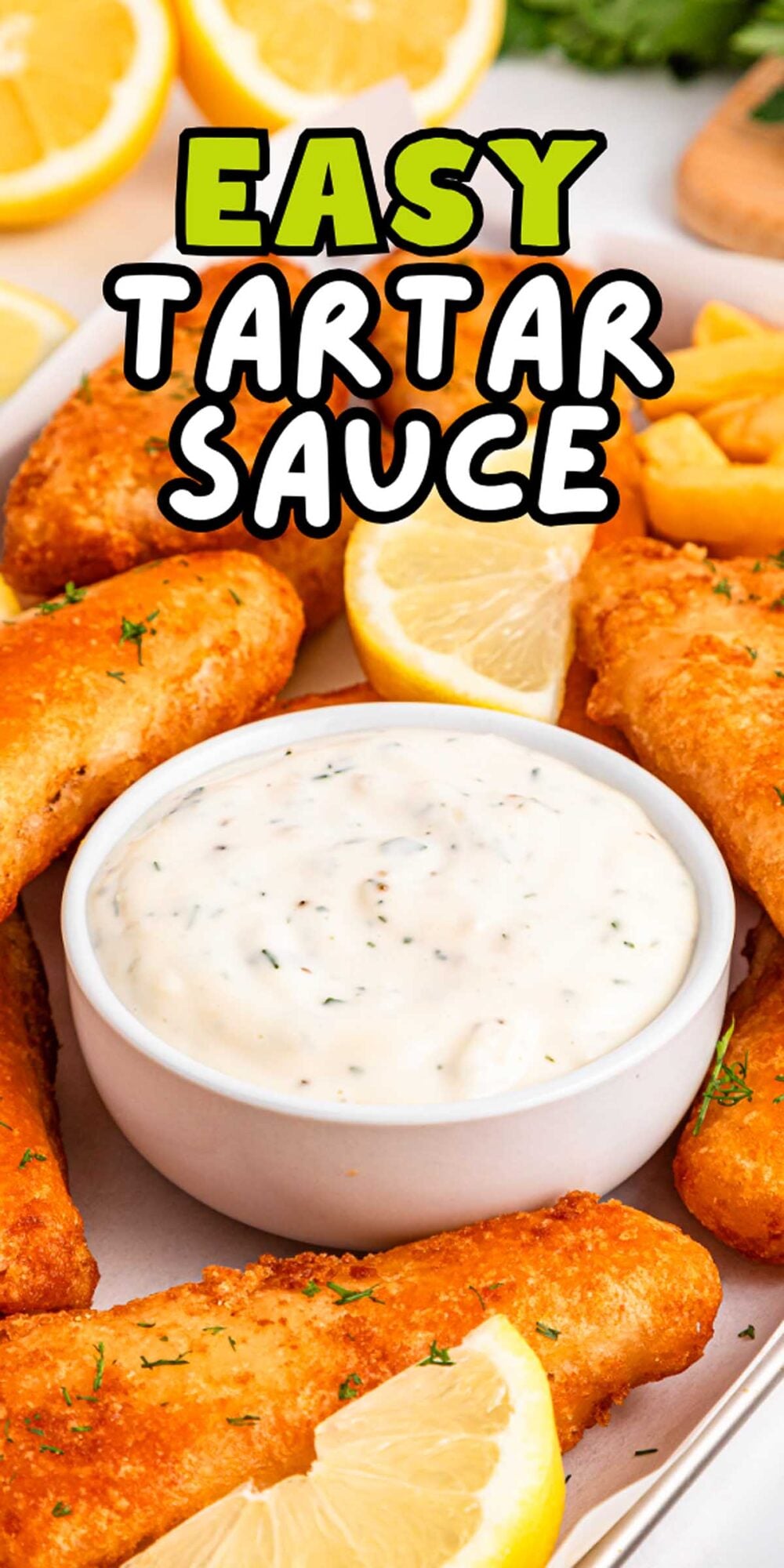 A bowl of easy tartar sauce surrounded by crispy fried fish and lemon wedges, with the text "Easy Tartar Sauce.