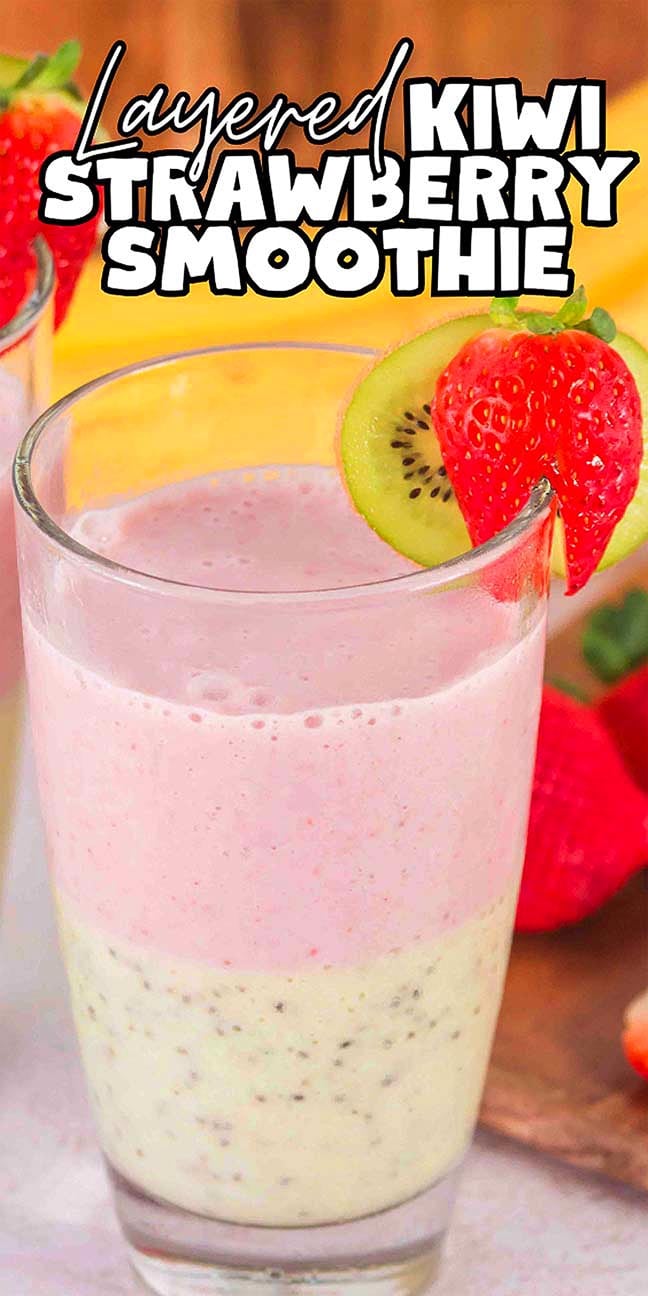 A glass of Layered Kiwi Strawberry Smoothie, beautifully presented with vibrant layers and garnished with a fresh kiwi slice and a strawberry.