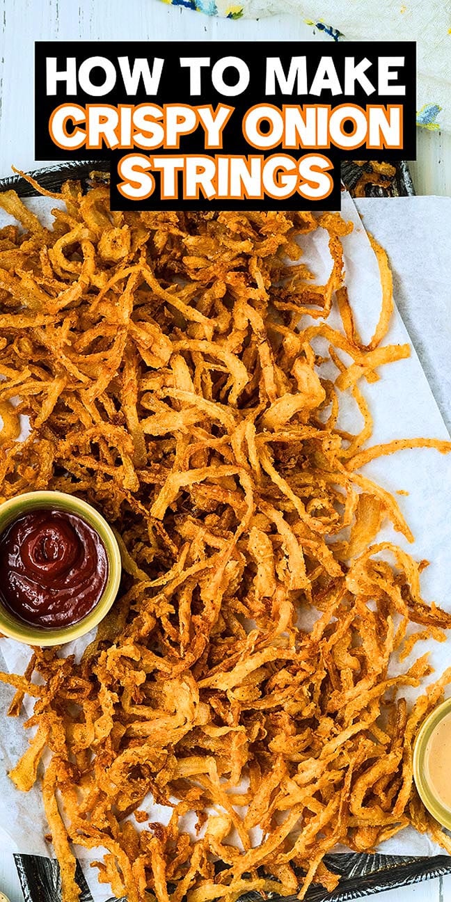 A tray of crispy onion strings with ketchup and a creamy dip, topped with text “How to Make Crispy Onion Strings”, perfectly showcases these golden, crunchy treats ready for dipping.