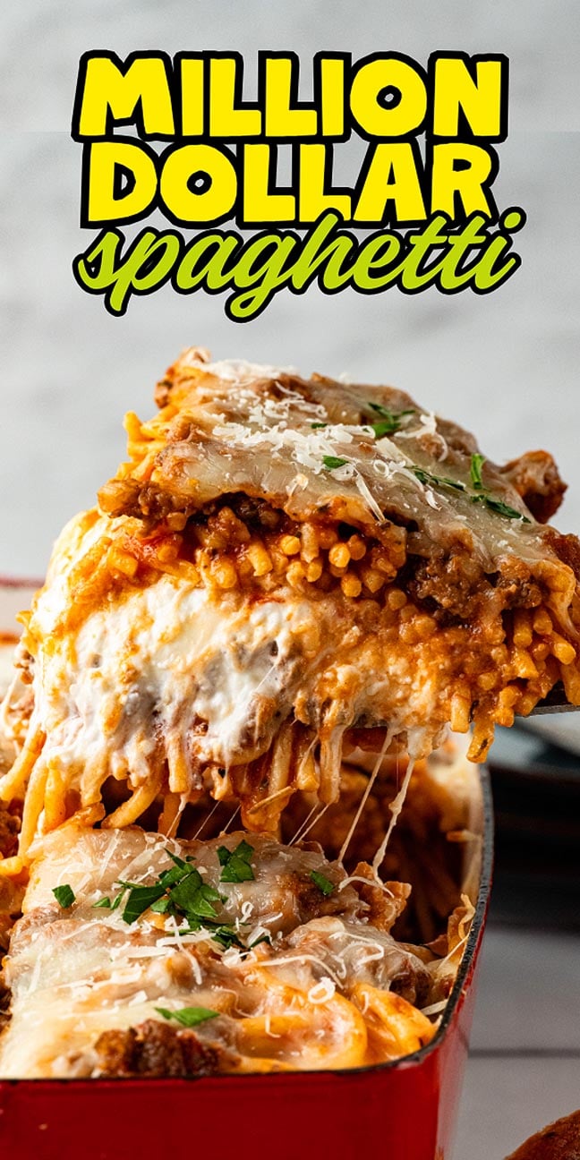Cheesy baked spaghetti being served from a red dish, topped with sauce, melted cheese, and fresh herbs.