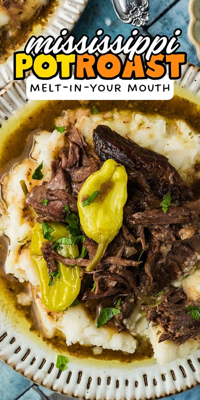 Plate of Mississippi pot roast with mashed potatoes, gravy, and peppers, garnished with chopped parsley.