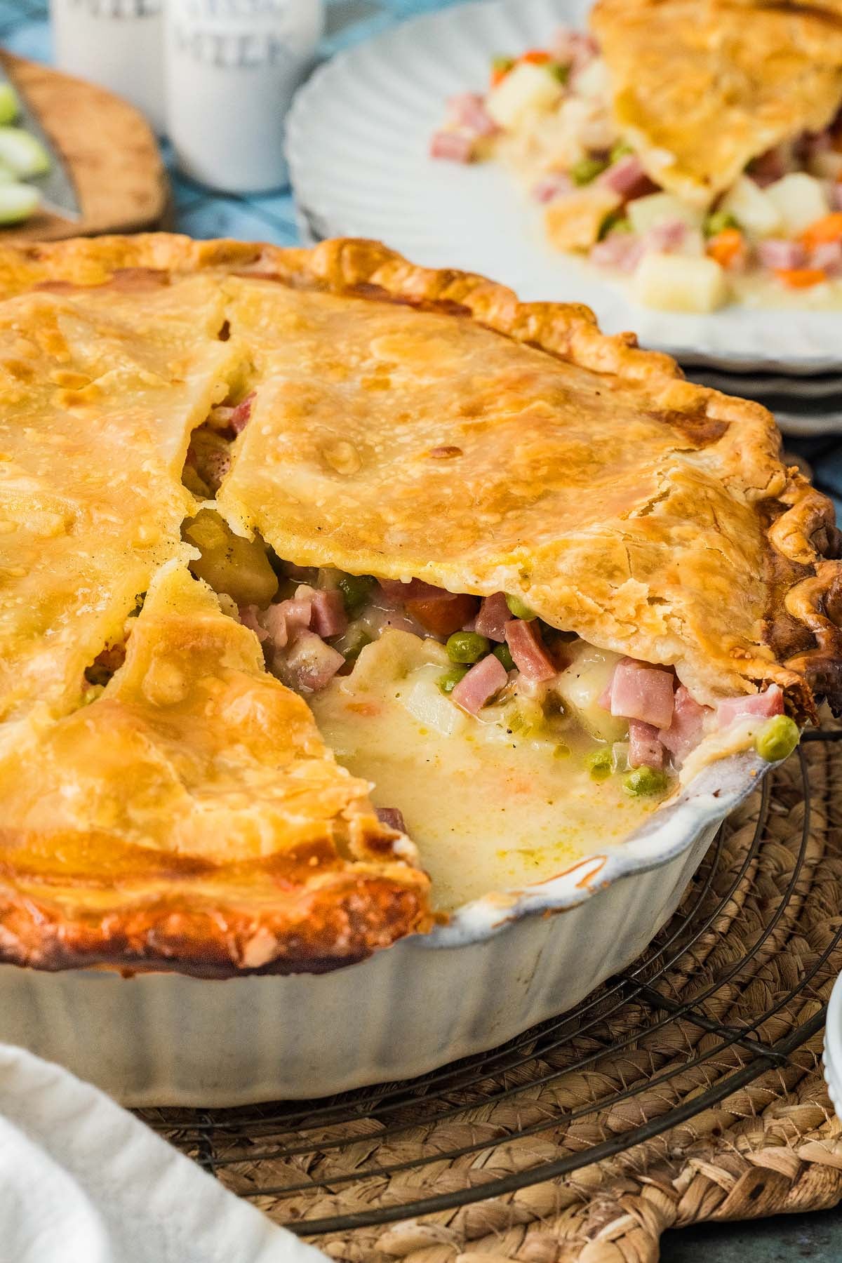 A golden-crusted pot pie filled with ham, peas, carrots, and potatoes.